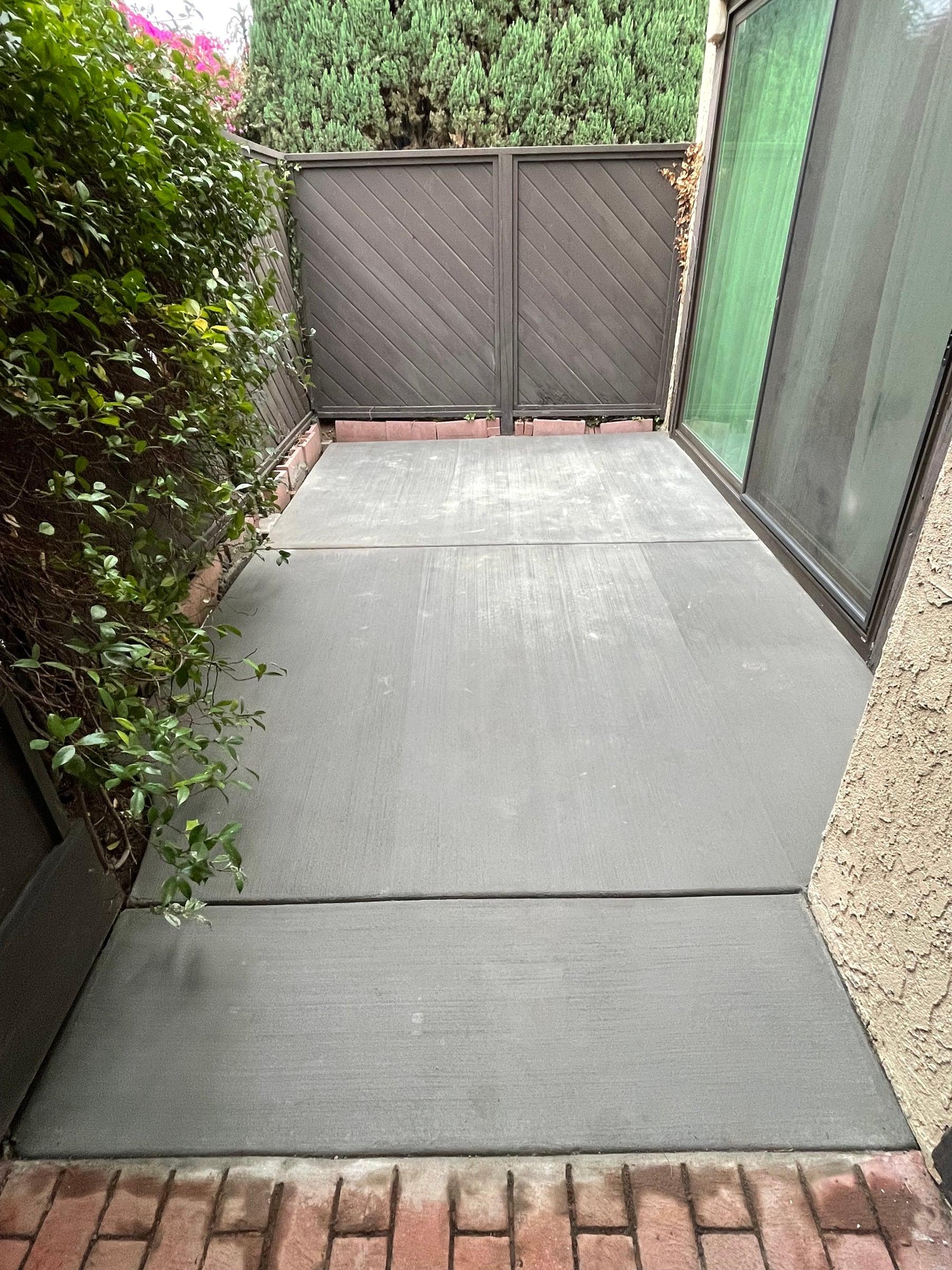New concrete side-yard walkway with a broom finish