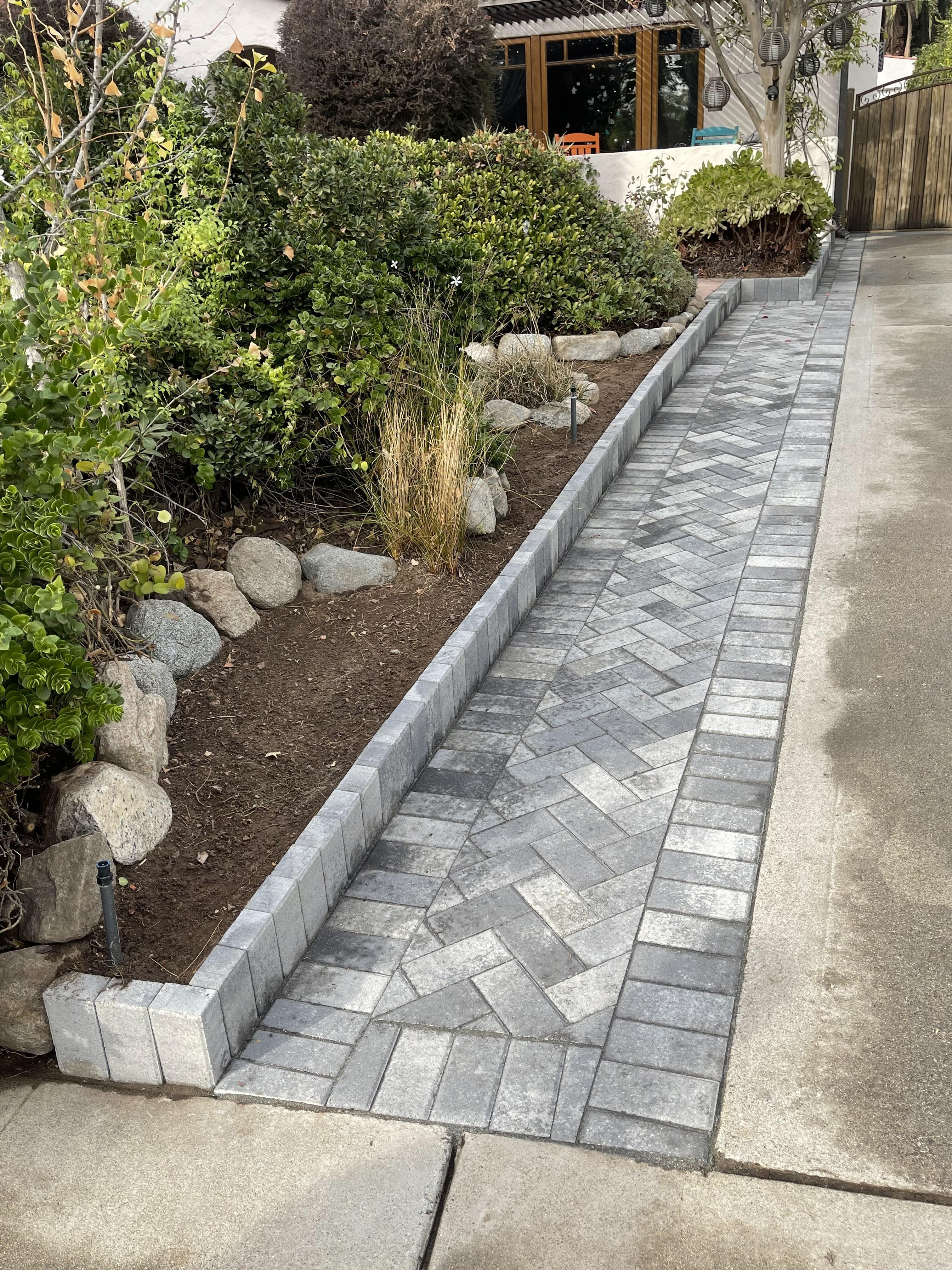 New concrete steps and retaining walls with fresh plantings