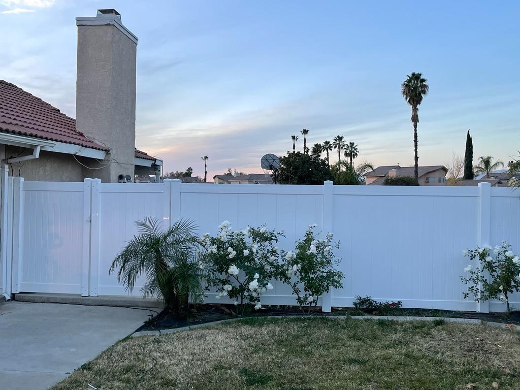 White PVC privacy fence installation