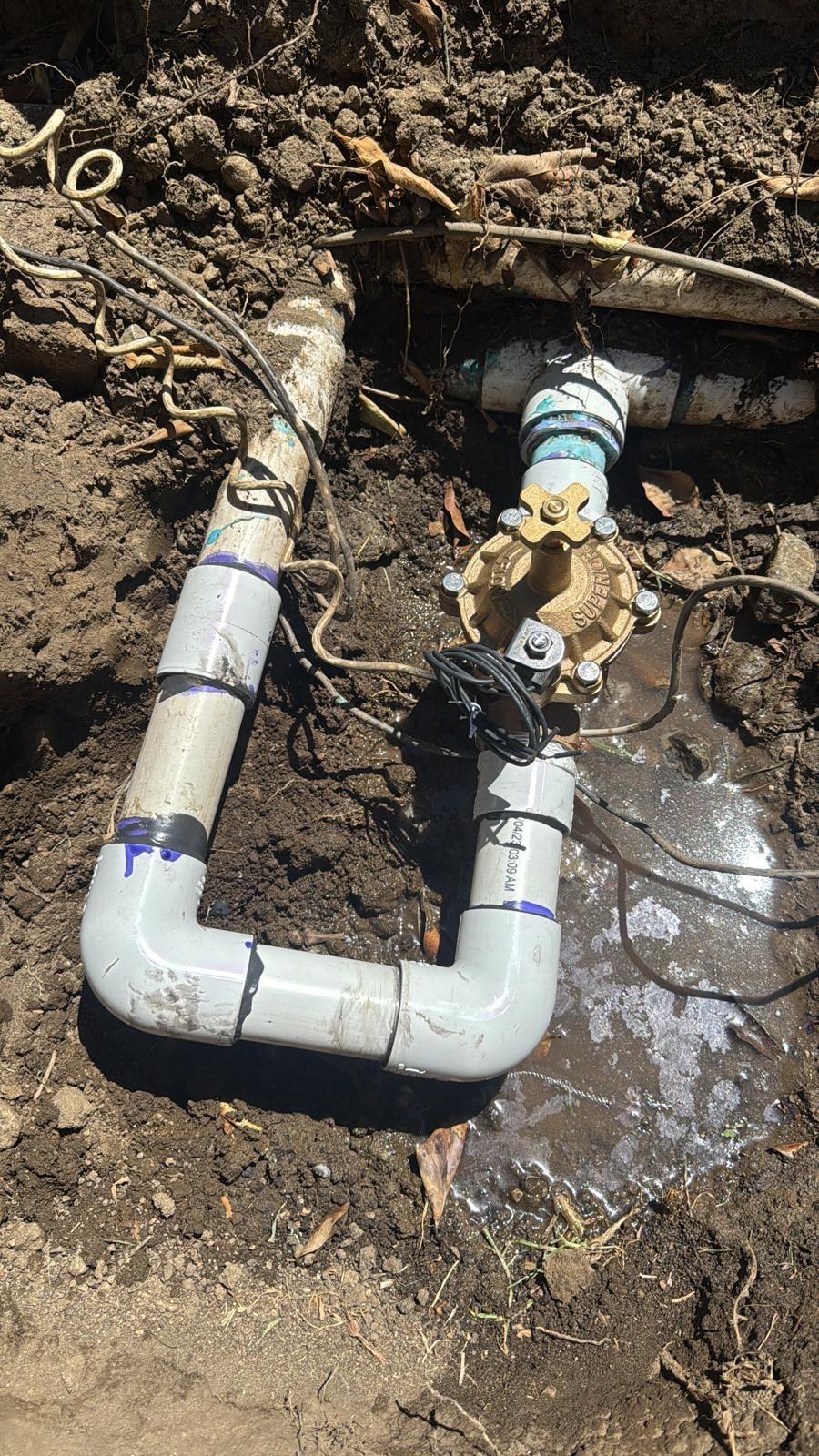 Newly connected brass gate valve on PVC irrigation piping