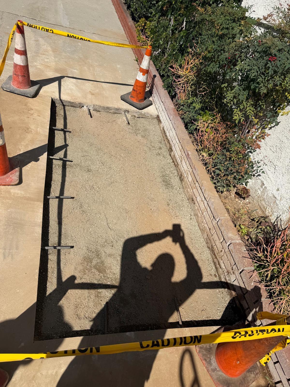 Repaired concrete section following irrigation trench work