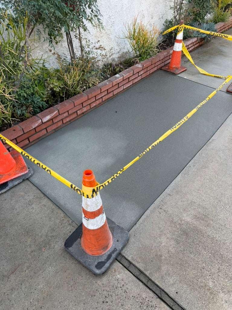Patched walkway section after irrigation line repair
