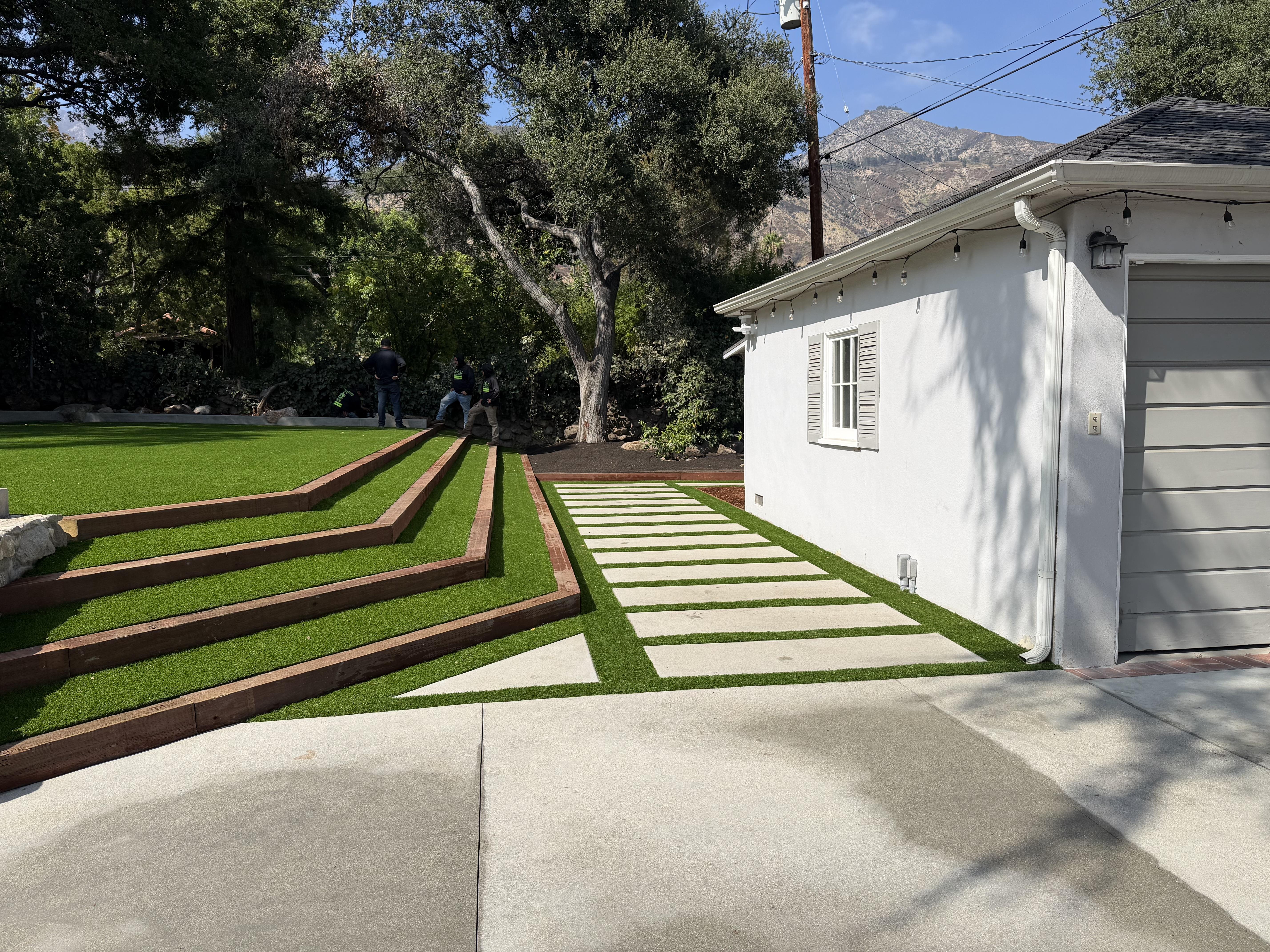 Completed front yard with a fresh sod lawn