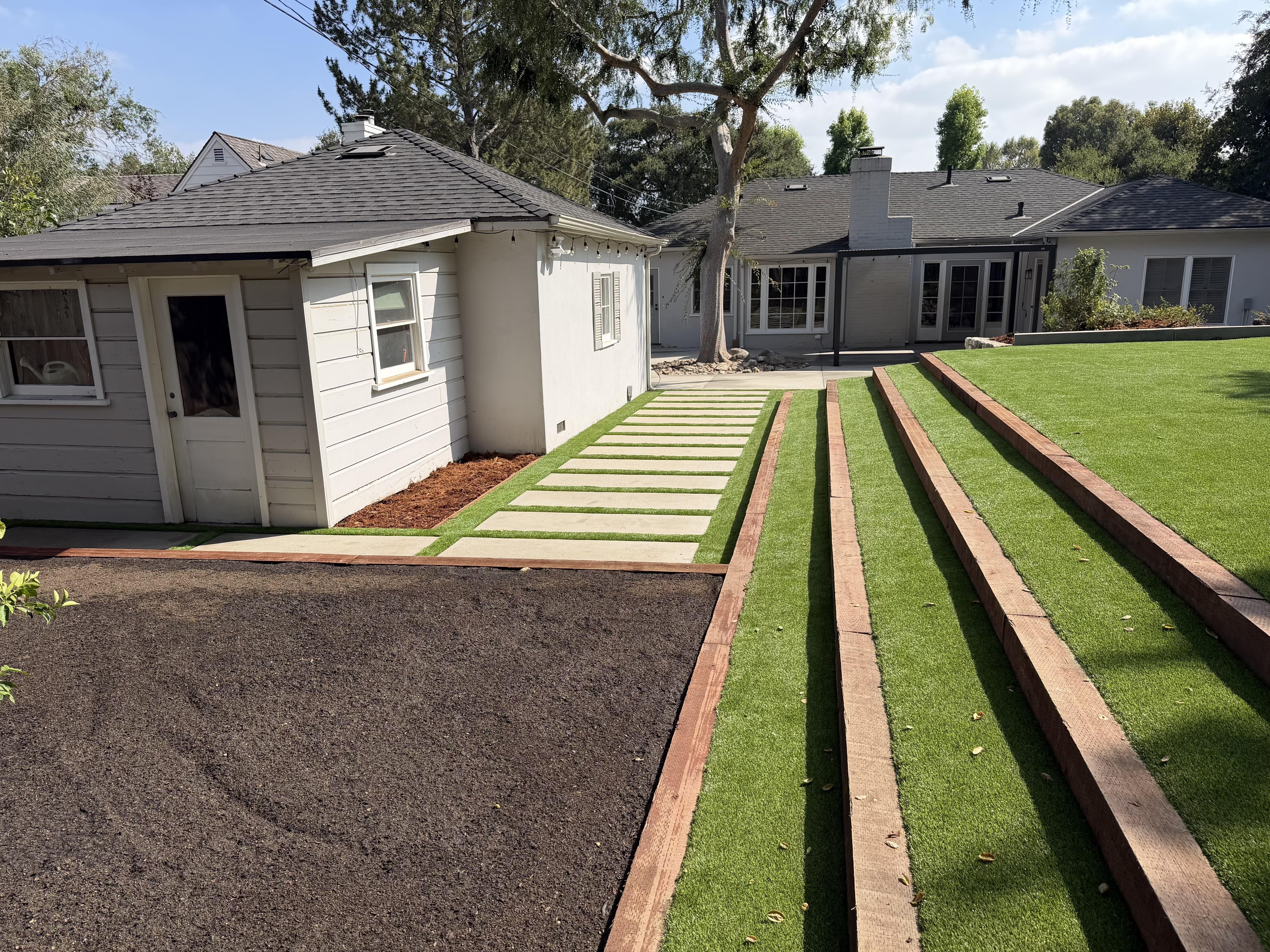 New sod strips being laid for a front yard lawn